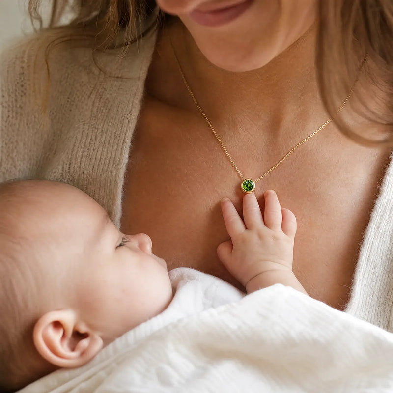 Mother wearing her child's stone